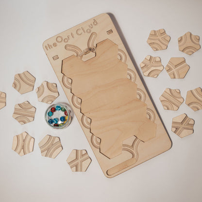 The Oort Cloud: A Marble Run Puzzle Game